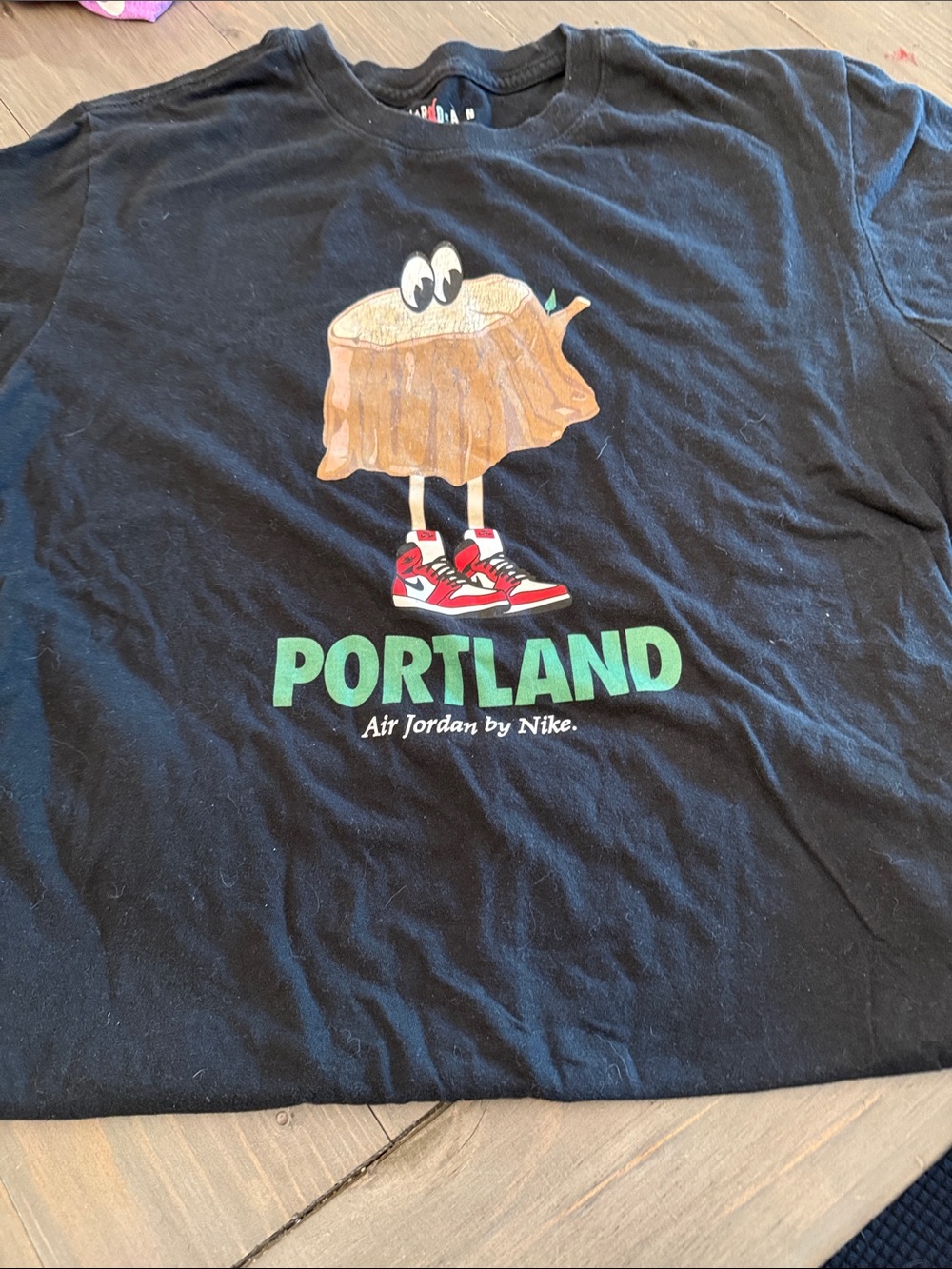 Nike Black Portland Graphic Tee with Red & Green Accents
Men’s med